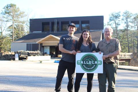 Megan Broome/The Clayton Tribune. Tallulah Adventures, LLC is coming to Tallulah Falls this summer. A soft opening will be held in the summer of 2022 and a grand opening is planned for the fall. Kyle Jerome, food service manager, left, Spencer Turk, with business development, and Bill Turk, managing member, stand in front of the old Georgia Power building that is being repurposed for the business a couple weeks ago. Crew members have continued the process of repurposing the facility. 