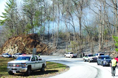 Megan Broome/The Clayton Tribune. The cause of a Highway 246 fire in Sky Valley remains unknown. A separate brush fire started across the state line in North Carolina.