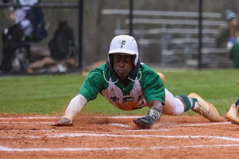 Photo by Austin Poffenberger. Joel Miller slides in safely at home for the Tallulah Falls Indians.
