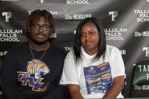 Photo by Lane Gresham. Norman Bastian who signed a national letter of intent to play baseball at Olivet Nazarene University poses for a photograph with his mother Alexandria Gabriel on the Tallulah Falls campus on March 23.
