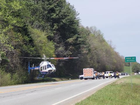 Megan Broome/The Clayton Tribune. A helicopter leaves from the roadway with an injured person from the April 15 crash.