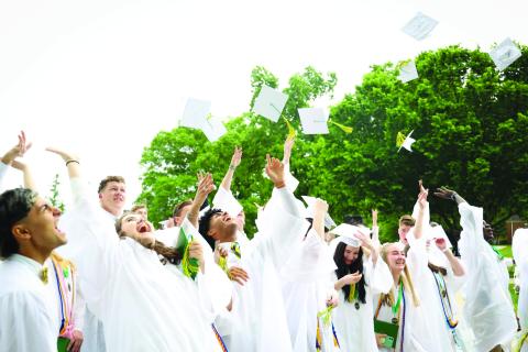 Photo courtesy RGNS. The Rabun Gap-Nacoochee School Class of 2022 tosses hats to celebrate the end of graduation on Sunday, May 15. The Class of 2022 is the largest graduating class in school history with 102 students. 