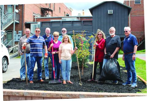 Megan Broome/The Clayton Tribune. Clayton Downtown Development Authority (DDA) members and Rotarians from the Rotary Club of Clayton plant flowers and a tree at the Charlie Mac Dickerson Memorial Park recently. Pictured are Keith Jackson; Tony Penrose; Matt Mitcham; Cassandra Clouser; DDA chair; Leif Ericson; Sonya Shook; Karen Bacon; Jim Antosiak; and Jef Fincher, Rotary Club of Clayton president. 