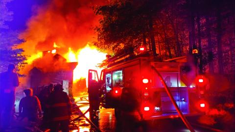 Photo courtesy of Conner Horn. Rabun County Fire Services continue to fight a three-story house fire on Lake Rabun Monday night. Crews remained on the scene into the morning hours. The fire could be seen for miles. The vacation house was deemed a complete loss.
