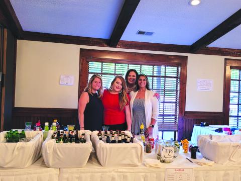 Megan Broome/The Clayton Tribune. Andria Robinson, Ashley Cabe, Natalie Dillard and Jo Flores work hard as they listen to the live music and enjoy the festivities at The Dillard House on Sunday. 