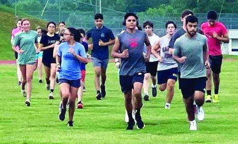 Enoch Autry/The Clayton Tribune. The cross country members get in their summer conditioning work on the Rabun County High School campus.