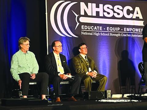 Submitted photo. C.J. Stockel is seen seated between fellow inductees Rick Huegli and Rich Lansky at the high school strength coaches induction ceremony.