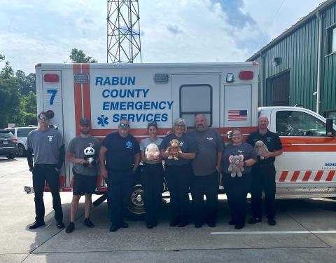 Submitted photo. Rabun County EMS receives a donation of stuffed animals from The Ryan Batchelder Foundation “Little Hugs.” Holding some of the donations are Paramedic Gary Jones; Paramedic Jackson Fischer; Paramedic David Lyle; AEMT Annie Lewis; Lieutenant Tammy Jones; EMT-I Josh Hickox; Paramedic Elisha Higgins; and Lieutenant David Cavender. 