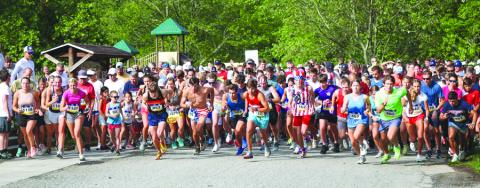 Photography courtesy Melissa Elzey. The combined 1,300 runners and walkers begin the two-mile fun run from Moccasin Creek in Clarkesville. 