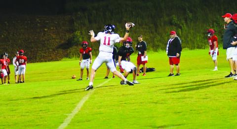 Enoch Autry/The Clayton Tribune. Rabun County starting quarterback Keegan Stover makes a throw during “Midnight Madness” at the school early in the morning of Aug. 1.