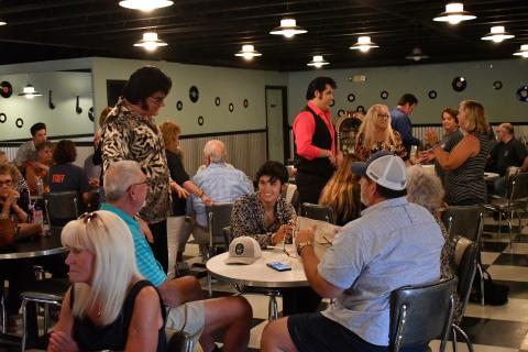 Enoch Autry/The Clayton Tribune. Here World Champion David Lee and 2021 Big E winner Austin Irby talk with guests at the event.