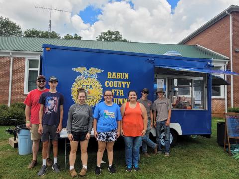 Megan Broome/The Clayton Tribune. Rabun County FFA served up good food at the 25th Dillard Bluegrass and Barbeque Festival August 5 and 6. Pictured are Rabun County FFA members James Hale, instructor; Noah Thurmond; Loren Mazarky; Ashlyn Dixon; Jalynn Pendry; Jonathan Aughtman; and Ethan Mazarky. Not pictured are Peyton Hicks; Eli Owens; and Melanie Beck. 