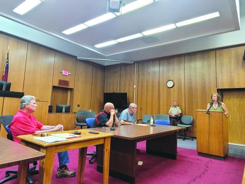 Megan Broome/The Clayton Tribune. Rabun County resident Lori Gamble-Barrett speaks to commissioners about questions and concerns regarding a projected county property tax increase of 11.14 percent during a public hearing on Aug. 11. 