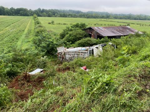 Photo courtesy of Brian Panell/Rabun County EMA Director. A 2015 Mack Granite carrying “blasting agents” overturned on its side early Tuesday morning at Kellys Creek Road in Rabun Gap. 