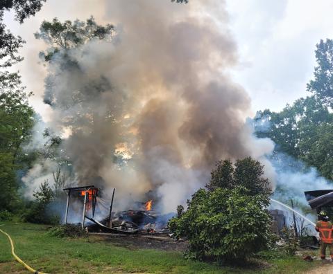 Megan Broome/The Clayton Tribune. Rabun County Fire Services work the scene of a structure fire on Flint Mountain Lane in Tiger Aug. 19. No injuries were reported.