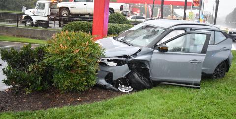 Megan Broome/The Clayton Tribune. This 2022 Silver Nissan Kicks crashed into the bushes beside the Chick-fil-A sign on Sunday, Sept. 4 following a two-vehicle crash in Clayton. 