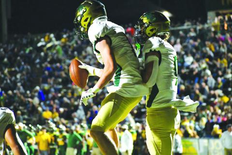 Luke Morey/The Clayton Tribune. Junior Trey Horne (left) celebrates a touchdown with sophomore Marshall Pritchett (right). Both players caught a touchdown on the night as well as Horne rushing for a touchdown.