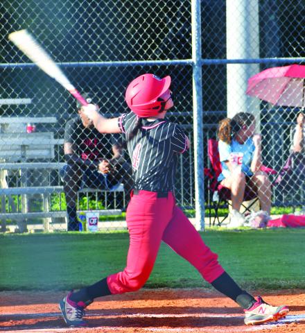 Luke Morey/The Clayton Tribune. Senior Mary Lovell hits a single during the game against East Jackson. Lovell ended the game with two runs, three hits, and two RBIs. Lovell and fellow senior Abigail Warren will be honored on the Lady Cats’ senior night, scheduled for Thursday night at 5 p.m.