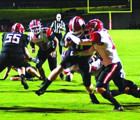 Enoch Autry/The Clayton Tribune. Senior quarterback Keegan Stover fights his way into the endzone for the only touchdown of the night for the Wildcats. Right after this play, he completed a two point conversion to Noah Legault to take a 14-7 lead. 