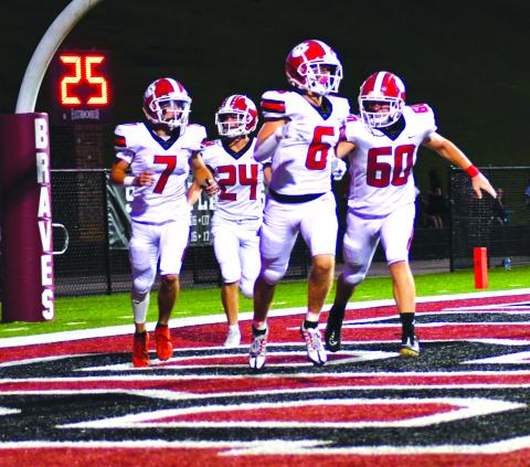 Enoch Autry/The Clayton Tribune. Rabun County’s Jaden Gibson (6) receives congrats from Braxton Brady (60), Lang Windham (7), and Riley Stewart (24) after the senior receiver scores the first of his two TDs in the win.