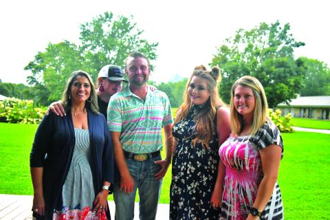 Megan Broome/The Clayton Tribune. Jo Flores, Natalie Dillard, Hunter Grayson, Ashley Cabe and Andria Robinson enjoy Labor Day weekend at The Dillard House on Sept. 4 with a BBQ cookout and live music performed by Grayson. The event promoted tourism to the area and brought the community together. 