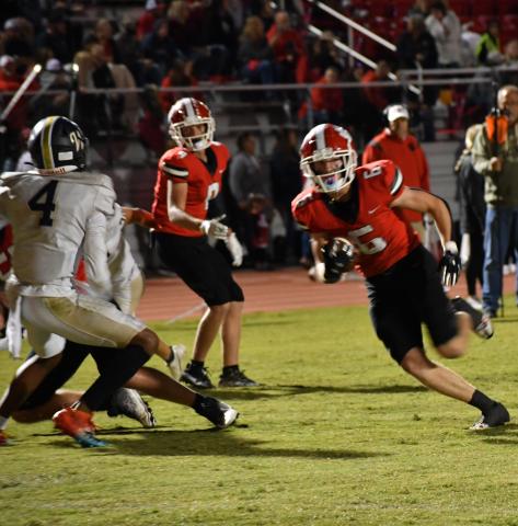 Luke Morey/The Clayton Tribune. Rabun County senior Jaden Gibson runs past defensive back Ayden Duncanson for his third touchdown of the night. Gibson has 13 touchdowns on the year, only six away from the most career recieving touchdowns in the Georgia state history. 