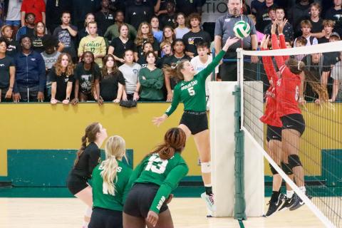 RGNS Athletics. Junior Peyton Brady tips the ball over the net