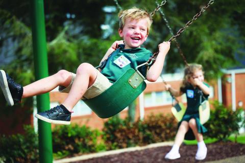Photo courtesy of Rabun Gap-Nacoochee School. Rabun Gap-Nacoochee School opened the 2022-2023 school year on Aug. 24. Pictured is Early Learning student Hunter Weber as he swings on the playground. Weber will be a part of the Class of 2036.