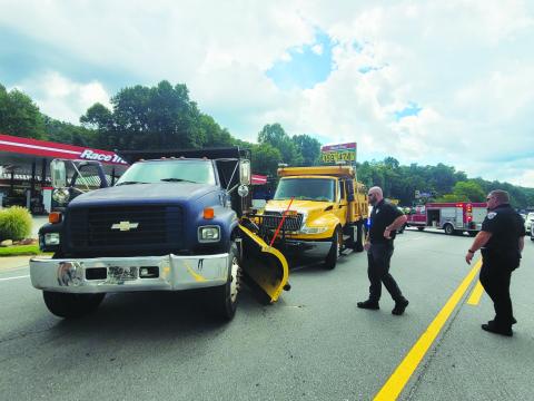 Megan Broome/The Clayton Tribune. Emergency personnel work the scene of a two-vehicle crash on Georgia 15 in front of RaceTrac in Clayton. 