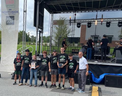 Submitted photo. Shown, from left, are Frankie Pribyl, Marc Crotta, Brooke Hayes, Matthew Wolfe, Jake Owensby, Teyrk Tilley, Merrick Carnes and Kennesaw Mayor Derek Easterling. 