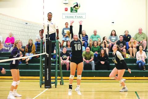 Courtesy of Austin Poffenberger. Senior Kitty Rodenas (center) sets the ball for junior Addy McCoy (right) during the Rocky Top Tournament