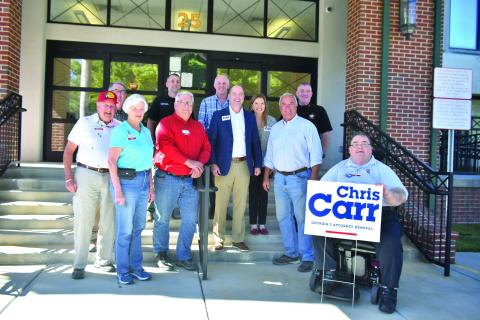 Megan Broome/The Clayton Tribune. Georgia Attorney General Chris Carr and his wife Joan stopped in Rabun County Sept. 27 to meet and greet public officials and community members. Front row: Charlie Brundage (left); Rabun County Republican Party Treasurer Linda Burns; Rabun County Republican Party Chair Ed Fickey; Georgia Attorney General Chris Carr; Commissioner Kent Woerner; and Rabun County Republican Party Secretary Ed Henderson. Back row: Scott Poss; Rabun County Sheriff’s Office Chief Deputy Scott Chee