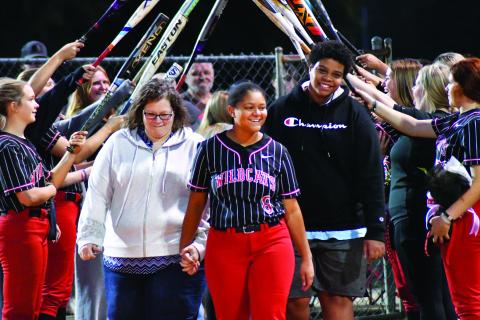 Enoch Autry/The Clayton Tribune. Senior Abigail Warren is escorted by her mother Tammie Payne and brother Joseph Payne. 