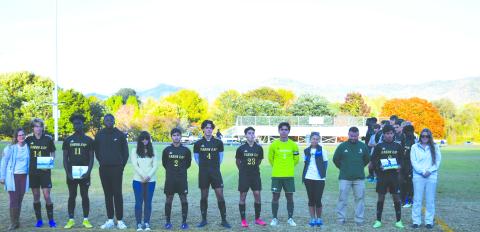 Luke Morey/The Clayton Tribune. The Rabun Gap-Nacoochee soccer seniors were honored before their last home game on Monday night. The seniors are from left, John Barta (14) with Keri Barta, Kyle Brako (11) with Tola Omatayo, Rafael Castillo (2) with Chelsea Dabrik and Guillermo Haro, Hugo Garcia (1) with Marcelo Gonzalez and Pam Weatherly, and Emilio Roman (8) with Mark Green and Alex Fagin.