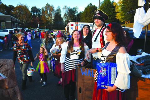 Enoch Autry/The Clayton Tribune. Employees from Walmart changed things up as these pirates gave out candy instead of taking.