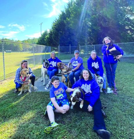 Submitted photos. From left, Allison Fish & Peaches; Carmen Rose & Loki; Mary Simonson with Sally & Blue; Bettina Justice & Hank; Holly Williamson & Lula; and Colton and Danielle Shetters with Oakey take a moment at the Rabun County Bark Park on Oct. 8 at the Shade-OutDM event.