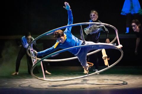 Photo courtesy Megan Morris/Rabun Gap-Nachoochee School. Cyrus Manoogian’24 of Rabun Gap, as Brian Dunning in Cirque Fantôme performs on the German wheel. Pictured in background, from left, are Juliette Teutsch ’24 of Demorest, Zoey Townsend ’23 of Cullowhee, N.C., and Parker Stribling’24 of Sautee Nacoochee, Ga. 