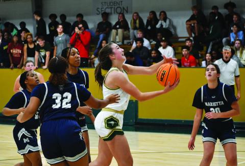 Luke Morey/The Clayton Tribune. Junior Sofia McNabb goes up for a basket in the scrimmage against Marietta on Wednesday night. McNabb had 13 points against North Oconee on Saturday for the Eagles’ first win of the season.