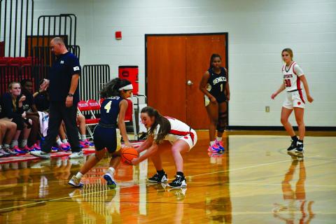 Luke Morey/The Clayton Tribune. Junior Mili Watts steals the ball in the scrimmage against Seneca last Thursday night. Watts had three steals along with 13 points and three assists.