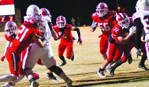 Enoch Autry/The Clayton Tribune. Rabun County senior wide receiver Jaden Gibson takes a direct snap for a two-yard rushing touchdown.  Gibson also added two receiving touchdowns on 10 catches for 201 yards. After winning 42-0 against Social Circle, RCHS will travel to take on Swainsboro on Friday, Nov. 25. The kickoff for the quarterfinal matchup between two ranked teams will be at 7 p.m.