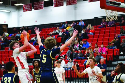 Luke Morey/The Clayton Tribune. Junior Cooper Welch hits a jumper against Seneca on Thursday. Welch will be leading the team as the sole returning starter to the squad. 
