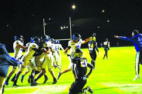 Luke Morey/The Clayton Tribune. Rabun Gap sophomore cornerback Onis Konanbonny falls to his knees after Charlotte Christian converted a last-second Hail Mary to advance to the state championship game. 