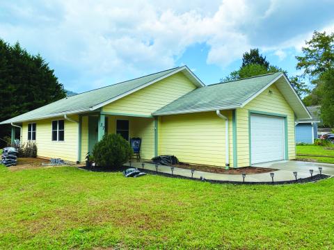 Submitted photo. Rabun County Habitat for Humanity had a blessing for its new Habitat House with community members welcoming Becky and Ayla into their new home Sunday, Oct. 30. 
