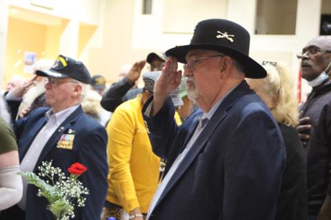 Megan Broome/The Clayton Tribune. Ray Kreiner, Army and 30-year veteran, salutes to honor fellow soldiers at the Veterans Appreciation Dinner Nov. 11, 2021. 