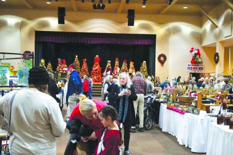 Luke Morey/The Clayton Tribune. Hundreds of visitors showed up to the Festival of Trees on Nov. 25 and 26 to see the 39 vendors who offered an array of items including mugs, wreaths, candles, award-winning BBQ sauce and paintings.