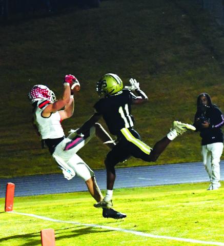 Luke Morey/The Clayton Tribune. Rabun County senior receiver Jaden Gibson gets his left foot down in the end zone for a receiving touchdown over Swainsboro sophomore Qindaruis Brown. This Gibson TD establishes a new state single-season touchdown reception total with 29 to surpass former RCHS receiver Adriel Clark’s 28 in 2020.