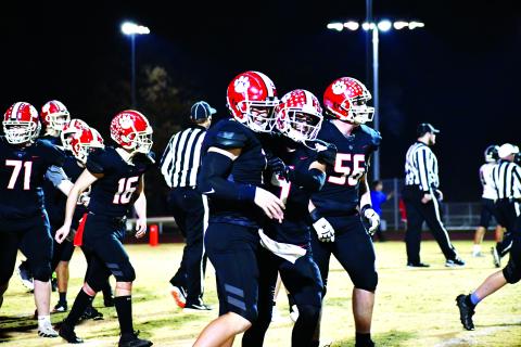 Luke Morey/The Clayton Tribune. Senior Keegan Stover (left) was named “Offensive Player of the Year” for Region 8 while senior Noah Legault (middle) made All-Region first team as a wide receiver. Both seniors transferred to Rabun County this year and made an immediate impact. Sophomore Alex Yearwood (56) also made the All-Region second team.
