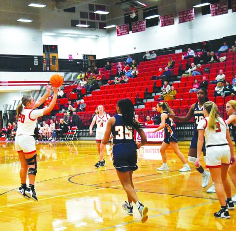 Luke Morey/The Clayton Tribune. Junior Ellie Southards hits a shot in the first quarter of the game against Lakeview as junior Lucy Hood (11)  looks on. Southards had 22 points on Wednesday, Dec. 21 to help the Lady Cats win 91-39. 
