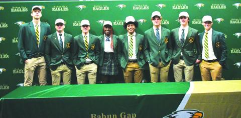 Luke Morey/The Clayton Tribune. On Wednesday, Dec. 7, eight Rabun Gap-Nacoochee School seniors signed their Letters of Intent to play at the collegiate level. From left, Domas Kauzonas (University of North Carolina Greensboro); Brody Roulier (Missouri S&T); Lewis Rodriguez (Marist); Calea Jackson (University of Miami): Armani Guzman (West Virginia); Nickolas Roy (University of Buffalo); Dylan Alonso (Middle Tennesee State) and Luke Earnhardt (Middle Tennessee State). 
