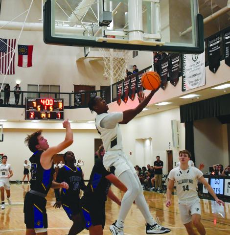 Luke Morey/The Clayton Tribune. Senior Anfernee Hanna hits a reverse layup in the first quarter aganst Lake Oconee Academy on Wednesday, Dec. 7. Hanna put up 56 total points over the past three games helping the Indians to a four game winning streak before falling to Oglethrope County.